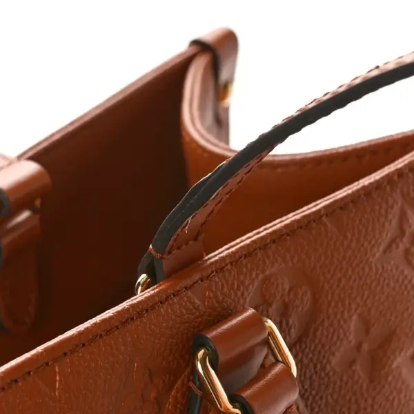 LV Neverfull MM Cognac Giant Monogram Empreinte Leather